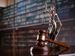 Gavel and statue in law library